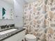 Charming bathroom with seashell shower curtain and granite vanity at 3523 52Nd W Ave, Bradenton, FL 34210