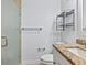 Small bathroom with shower, granite countertop, and metal shelving at 3523 52Nd W Ave, Bradenton, FL 34210