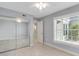 Bedroom with mirrored closet doors and tile floors at 3523 52Nd W Ave, Bradenton, FL 34210