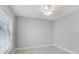 Well-lit bedroom with tile floors and ceiling fan at 3523 52Nd W Ave, Bradenton, FL 34210
