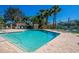 Enjoy the community pool with clear blue water, comfortable lounge chairs, and a secure fenced-in area at 3523 52Nd W Ave, Bradenton, FL 34210