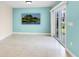 Dining area with light tile floors, sliding glass doors, and golf course view at 3523 52Nd W Ave, Bradenton, FL 34210