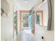 Open entryway with teal door leading to the backyard at 3523 52Nd W Ave, Bradenton, FL 34210