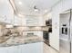 Modern kitchen with granite countertops and stainless steel appliances at 3523 52Nd W Ave, Bradenton, FL 34210