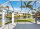 Screened patio with canal and palm tree views at 3523 52Nd W Ave, Bradenton, FL 34210