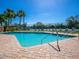 Enjoy the community pool and palm trees on a sunny day at 3523 52Nd W Ave, Bradenton, FL 34210