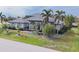 Large house with tile roof, landscaping, and driveway at 3607 Darin Dr, Punta Gorda, FL 33950