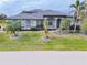 Two-story house with gray exterior and palm trees at 3607 Darin Dr, Punta Gorda, FL 33950
