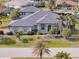 Spacious home with tile roof, lush landscaping, and a canal view at 3607 Darin Dr, Punta Gorda, FL 33950