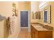 Clean bathroom with granite vanity and a large mirror at 3607 Darin Dr, Punta Gorda, FL 33950