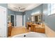 Bathroom with double vanity, soaking tub, and a separate shower at 3607 Darin Dr, Punta Gorda, FL 33950