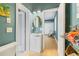 Bathroom with sink, toilet, and view into another room at 3607 Darin Dr, Punta Gorda, FL 33950