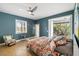 Bedroom with a colorful bedspread, tiled floor, and access to a patio at 3607 Darin Dr, Punta Gorda, FL 33950