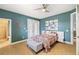 Bright bedroom with a patterned bedspread and large closets at 3607 Darin Dr, Punta Gorda, FL 33950