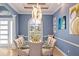 Formal dining room with glass table and chandelier at 3607 Darin Dr, Punta Gorda, FL 33950