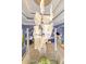 Modern, multi-light glass chandelier illuminates the dining room at 3607 Darin Dr, Punta Gorda, FL 33950