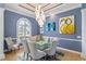 Formal dining room with glass table, chandelier, and art at 3607 Darin Dr, Punta Gorda, FL 33950
