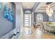 Elegant entryway with tile floor, dining area, and art at 3607 Darin Dr, Punta Gorda, FL 33950