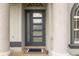 Modern gray front door with glass panels at 3607 Darin Dr, Punta Gorda, FL 33950