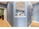 Short hallway with decorative wall accent and view into another room at 3607 Darin Dr, Punta Gorda, FL 33950