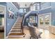 Grand two-story foyer with elegant staircase, and access to the backyard pool at 3607 Darin Dr, Punta Gorda, FL 33950