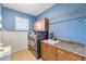Bright laundry room with washer, dryer, and cabinets at 3607 Darin Dr, Punta Gorda, FL 33950