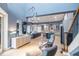 Open-concept living space showcasing a kitchen, living area, and staircase at 3607 Darin Dr, Punta Gorda, FL 33950