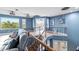 Open loft overlooking the lower level and backyard at 3607 Darin Dr, Punta Gorda, FL 33950