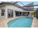 Inviting pool area with covered patio and spa at 3607 Darin Dr, Punta Gorda, FL 33950
