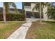 Pathway through manicured lawn and tropical plants at 3607 Darin Dr, Punta Gorda, FL 33950