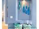 Glass wall art and decorative objects accent a blue accent wall at 3607 Darin Dr, Punta Gorda, FL 33950