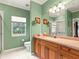 Bathroom with wood vanity, single sink and shower at 3665 Square West Ln # 13, Sarasota, FL 34238