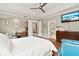 Bedroom with king bed, walk-in shower, and TV at 3665 Square West Ln # 13, Sarasota, FL 34238