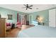 Bright bedroom with king-size bed and flat-screen TV at 3665 Square West Ln # 13, Sarasota, FL 34238