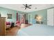 Spacious bedroom with wood floors, sliding glass doors to balcony at 3665 Square West Ln # 13, Sarasota, FL 34238