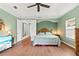 Main bedroom with wood floors and private balcony access at 3665 Square West Ln # 13, Sarasota, FL 34238