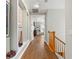 Hallway with hardwood floors and built-in niches at 3665 Square West Ln # 13, Sarasota, FL 34238