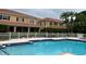 Inviting community pool with ample deck space at 3665 Square West Ln # 13, Sarasota, FL 34238