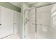 Walk-in shower with glass enclosure and grab bars at 3665 Square West Ln # 13, Sarasota, FL 34238