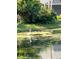 Serene waterfront view showcasing natural Florida wildlife at 3665 Square West Ln # 13, Sarasota, FL 34238