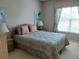 Bedroom with double bed and nightstands at 4220 Pinebrook Cir # 12, Bradenton, FL 34209