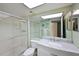 Bathroom with marble vanity and shower at 425 30Th W Ave # C102, Bradenton, FL 34205