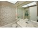 Clean bathroom with shower and tub at 425 30Th W Ave # C102, Bradenton, FL 34205
