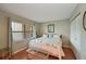 Main bedroom with large bed and window at 425 30Th W Ave # C102, Bradenton, FL 34205