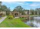 Lakeside gazebo with seating and a tranquil water view at 425 30Th W Ave # C102, Bradenton, FL 34205