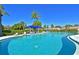 Inviting community swimming pool with a shaded seating area at 425 30Th W Ave # C102, Bradenton, FL 34205