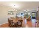 Open dining area with view of living room and kitchen at 425 30Th W Ave # C102, Bradenton, FL 34205