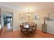 Dining room with wooden table, chairs, and hardwood floors at 425 30Th W Ave # C102, Bradenton, FL 34205