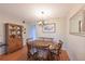 Bright dining area with wooden table and hutch at 425 30Th W Ave # C102, Bradenton, FL 34205