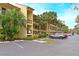 Two-story condo building with ample parking and lush landscaping at 425 30Th W Ave # C102, Bradenton, FL 34205